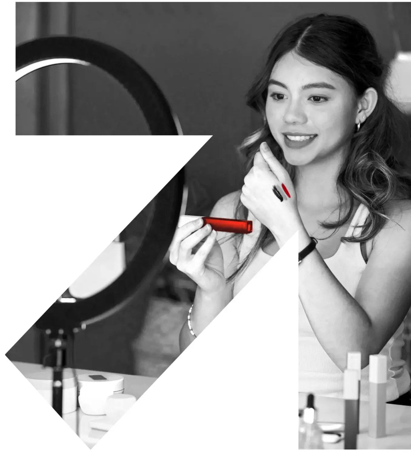 Content creator presenting beauty products in front of a ring light
